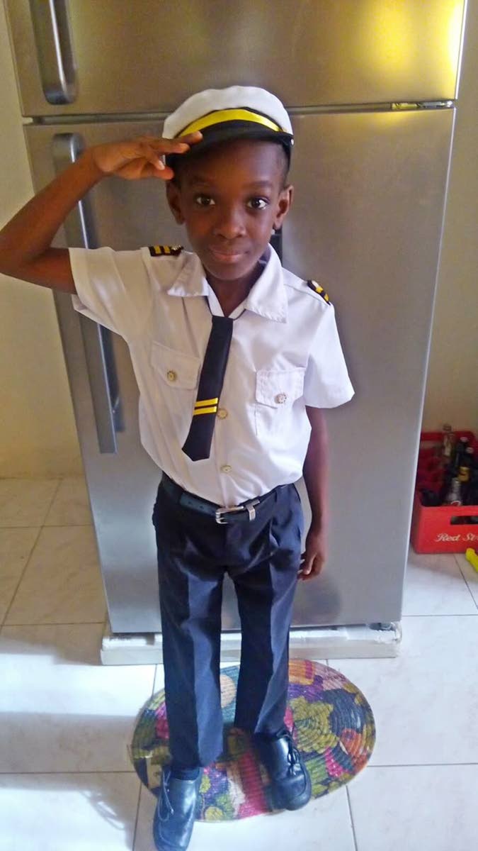 A younger Mikhail Grey (while at prep school) in a pilot’s uniform. Jamaica Gleaner, 26 August 2026.
