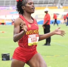 Tiana Marshall of Wolmer’s Girls wins the Class 1 100m hurdles. Photo: Naphtali Junior / Jamaica Observer