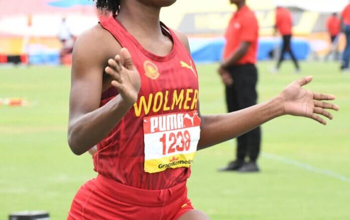 Tiana Marshall of Wolmer’s Girls wins the Class 1 100m hurdles. Photo: Naphtali Junior / Jamaica Observer