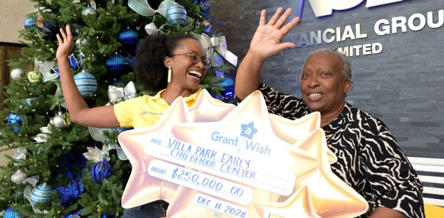 Charlotte Nembhard receives a $200,000 NCB Foundation Grant a Wish cheque. Jamaica Gleaner