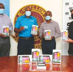 Garfield Reece, Dwight K. Williams, Dwight Pennycooke and Sean Paul at the tablet handover. Jamaica Observer