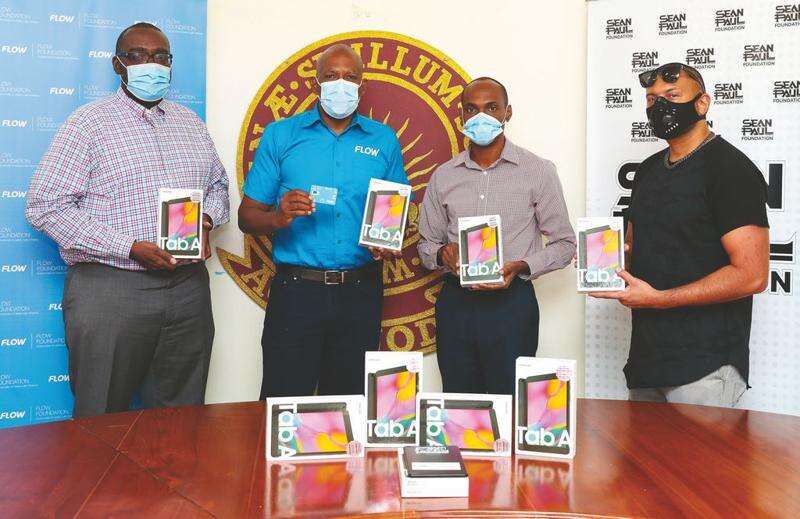 Garfield Reece, Dwight K. Williams, Dwight Pennycooke and Sean Paul at the tablet handover. Jamaica Observer