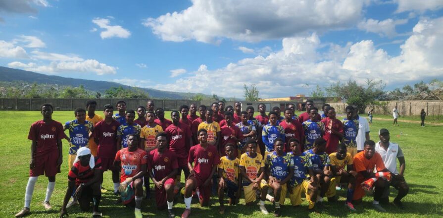 Members of the Wolmer’s Boys’ School Manning Cup team show solidarity with St Elizabeth Technical High School’s daCosta Cup players. Jamaica Gleaner