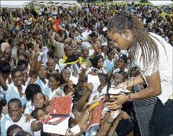 Shelly-Ann Fraser signs autographs at Wolmer’s Girls. Photo: Junior Dowie / Jamaica Gleaner, 7 October 2008