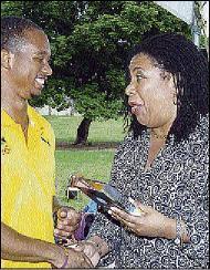 Pauline Findlay presents Michael Frater with a plaque at Wolmer’s Girls. Photo: Junior Dowie / Jamaica Gleaner, 7 October 2008