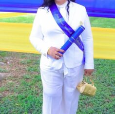Trecha Thomas poses with her son Jean-Pierre Samuels’ master’s degree. Photo: Contributed. Jamaica Gleaner, 26 September 2026.