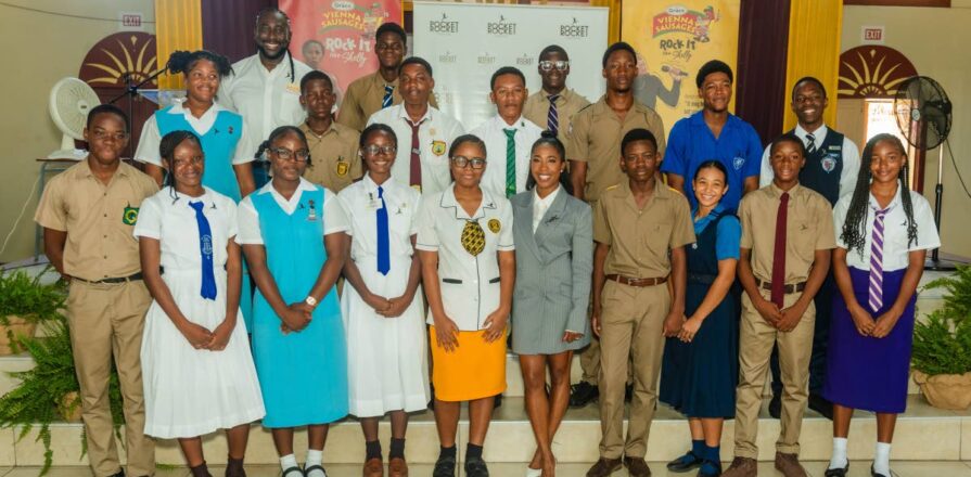 Shelly-Ann Fraser-Pryce, founder and chairwoman of the Pocket Rocket Foundation, and Dr Jermaine McCalpin, executive director, are joined by members of the foundation’s 2026 scholarship cohort following the annual Scholarship Awards at the Wolmer’s Girls’ School Hall in Kingston, on Thursday, Septem