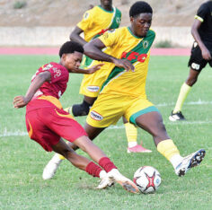 Wolmer’s Boys’ Jude Davis (left) plays the ball while coming under a challenge from Excelsior High’s Tristan Bethune during their ISSA Walker Cup game at the Stadium East Field on Saturday. (Photo: Garfield Robinson) Jamaica Observer, October 4, 2026.