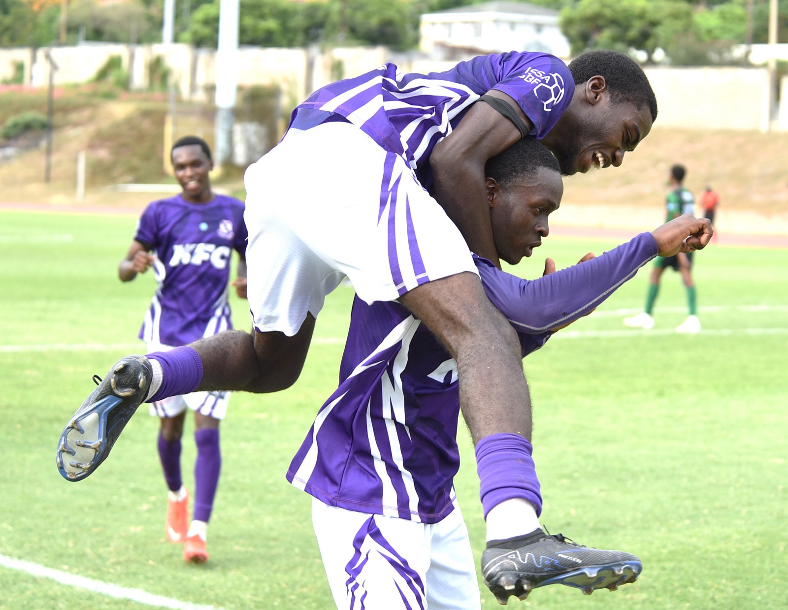Members of the Kingston College team celebrate after scoring against Calabar High during their Walker Cup KO football match at the Stadium East field yesterday. Jamaica Star, September 30, 2026.